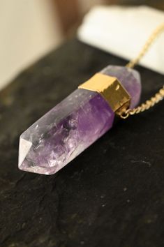 "This large Amethyst crystal necklace is the one you've been dreaming of. It's a statement necklace like no other with it's beautiful double-terminated Amethyst gemstone and gold curb chain! Amethyst, known as the Stone of Spiritual Wisdom, is believed to enhance intuition, calm the mind, and foster a sense of inner peace. Wearing this beauty not only elevates your style but invites the harmonizing influence of Amethyst into your daily life.  ▲ Double-terminated Amethyst gemstone pendant approximately 3\" in length x .75\" in width ▲ Gold curb chain 4 x 5mm ▲ Handmade in Arizona Also available in silver | model wears 24\" necklace. Please use sizing guide below to confirm the length you need.  Want to see more crystal necklaces? https://etsy.me/3hPv5EZ ✦ S I Z I N G ✦ Length is the open ne Mughal Jewelry, Highest Self, Amethyst Crystal Necklace, Silver Model, Gold Long Necklace, Spiritual Wisdom, Amethyst Necklace, Amethyst Pendant, Birthstone Necklace