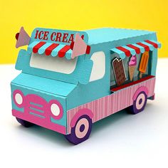 an ice cream truck is painted pink and blue