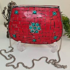 This bag is a statement piece of jewelry with mosaictiles stones of Corals, Turquoise, Silver & Brass. Boho Clutch metal bag-purse that won't stop bringing you complements and turn heads around. Handmade from Brass and inlaid with stones, one by one, makes every purse one of a kind ethnic bohemian clutch purse, tribal style, vintage look evening bag. Made in the Himalayas, inside filled with velvet, to complete the ethnic but elegant look for each bag. You can hang it on your shoulder or use Mosaic Stones, Bohemian Clutch, Metal Mosaic, Beacon Ny, Boho Clutch, Metal Bag, Purse Handmade, Handmade Mosaic, Metallic Bag