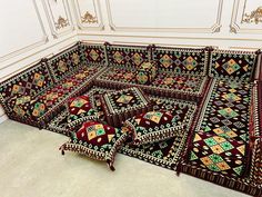 a group of rugs sitting on top of a white floor next to each other