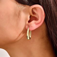 Elevate your elegance with these stunning Elongated Hoop Earrings. These earrings feature a sleek, elongated design that exudes modern sophistication and timeless charm. Perfect for any occasion, from casual outings to formal events, these versatile hoops add a touch of refined glamour to any outfit. - Made in 14k solid gold - Earring Width: 6.25 mm / 0.24 inches - Thickness: 6.90 mm / 0.27 inches - Length: 28.11 mm / 1.10 inches - This product comes with iconic Norm Jewels gift box Elegant Oblong Earrings, Classic Oblong Hoop Earrings, Solid Gold Earrings, Earrings In Gold, Gold Earring, Signet Ring, Rings Statement, Ring Bracelet, Wedding Rings Engagement