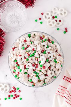 a bowl filled with white and green cereal next to red and green candy canes