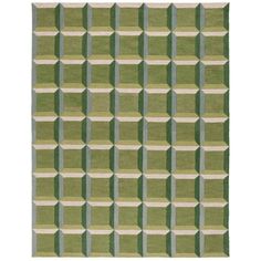 an area rug with green and white squares on the side, in front of a white background