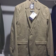 Khaki Blazer Size Xs Fits In Between A Xs And A S. Brand New Never Been Worn. Open To Offers! Casual Slim Fit Blazer For Fall, Casual Fall Slim Fit Blazer, Winter Casual Slim Fit Blazer, Casual Summer Blazer For Everyday, Fitted Summer Outerwear For Everyday, Casual Cotton Blazer In Solid Color, Casual Solid Cotton Blazer, Casual Fitted Summer Outerwear, Fitted Casual Summer Outerwear