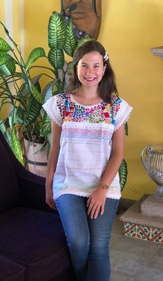 Beautiful traditional Mexican blouse made on a pedal loom with floral motifs, hand-embroidered in bright thread. Blouses have unique embroidery so may vary. Mexican textile art has centuries of history and creativity throughout the country. Mexico is recognized as one of the leading countries with a beautiful artistic production in the textile world, miraculous hands of talented artisans from different states of the country create stunning embroidery clothing, and various items. #Oaxaca #Chiapas Cotton Blouse With Multicolor Embroidered Sleeves, Cotton Blouse With Multicolor Embroidery And Embroidered Sleeves, Bohemian Top With Multicolor Embroidery, Casual Multicolor Top With Intricate Embroidery, Bohemian Embroidered Fabric With Border For Spring, White Embroidered Summer Blouse Piece, Casual Tops With Intricate Embroidery For Festivals, Bohemian Embroidered Top With Multicolor Floral Embroidery, Bohemian Embroidered Top With Multicolor Floral Design