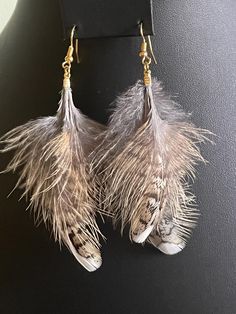 Beautiful Canadian Ruffed Grouse Feather Earrings.   Each set of earrings is unique and measure approximately 4 inches from the earring hook to the bottom of the feathers.  These will arrive in a classic small gift box ready to present to your mom, sister, co-worker, daughter and/or friend -- great for Birthdays, Retirement, Christmas, Thanksgiving, Bachelorette Parties or any other special occasion. Loved by everyone from young girls to grandmas!! Due to the nature of a feather these should be Grouse Feather Earrings, Diy Feather Earrings, Ruffed Grouse, Diy Leather Earrings, Small Gift Boxes, Bachelorette Parties, Feather Earrings, Leather Diy, Small Gift