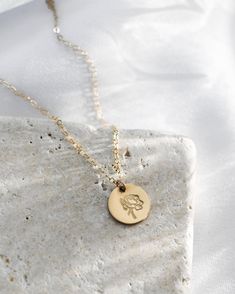 · 1/2" (12.7mm) disc· 14k yellow gold fill, 14k rose gold fill, and sterling silver options· Sturdy, timeless, and built to be worn everydayOur classic 1/2” necklaces are easy to layer, elegant, and ready to be personalized with your most special sentiments, moments, and memories! Created to last a lifetime, these necklaces will remain evergreen even as the years and trends come and go.Personalizing your piece with a message? Reference our fonts and symbols chart for font options and character m Dainty 14k Gold Filled Engraved Charm Necklaces, Rose Gold Sterling Silver Tarnish Resistant Charm Necklaces, Tarnish Resistant 14k Gold Filled Necklace With Round Pendant, Nickel Free Rose Gold Sterling Silver Necklace, Rose Gold Pendant Necklace For Everyday, Rose Gold Sterling Silver Nickel-free Necklace, Nickel-free Rose Gold Sterling Silver Necklace, Everyday Rose Gold Sterling Silver Necklace, Everyday Birth Flower Charm Necklaces