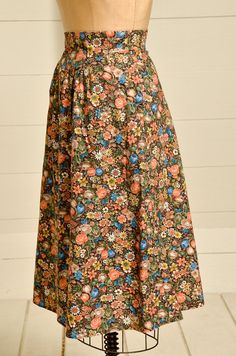 "1970s Prairie Skirt Brown & Rust Floral Bouquet Print Western Dress 70s high waisted prairie skirt. In good condition, no damage to note. Two side pockets with hidden zipper in the back. No tag or size marked. Fits like a Small, but please refer to measurements. Measurements waist: 25\" length: 29\"" Vintage Skirt For Garden Party, Spring Vintage Gathered Skirt, Vintage Long Gathered Skirt, Vintage Long Gathered Skirt Bottoms, Fall Vintage Maxi Skirt, Spring Vintage Lined Maxi Skirt, Vintage Cotton Maxi Skirt, Vintage Lined Maxi Skirt For Spring, Vintage Gathered Maxi Skirt For Spring