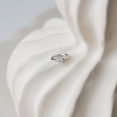 Our stunning Mini Diamond Solitaire Seamless Hoop is the must have piece for your dream ear stack! Perfect for a rook, helix and tragus piercing but it also looks great in the high lobe. Made in solid 14 karat white gold.  Diamonds are April's birthstone but also known to be a symbol of purity and absolute truth.  Sold as a single Solid 14k White Gold  This metal can be worn all day every day. It will not tarnish and can be cleaned with warm soapy water and a soft non-abrasive cloth. If wearing Everyday White Gold Diamond Cartilage Earrings, Delicate White Gold Huggie Earrings For Anniversary, Minimalist White Gold Huggie Earrings For Wedding, Elegant Small Hoop Rings With Prong Setting, White Gold Hoop Earrings With Single Diamond For Anniversary, Anniversary White Gold Hoop Earrings With Single Diamond, Elegant Sterling Silver Huggie Earrings With Single Diamond, Minimalist Diamond Cartilage Earrings For Wedding, Elegant Small Hoop Cartilage Earrings In White Gold