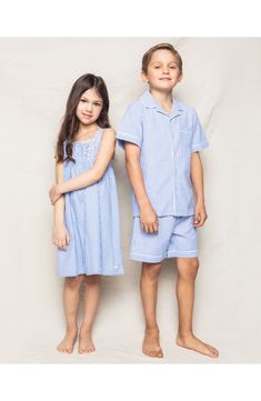 Keep your little one cool and comfy in these short pajamas cut from cotton-blend striped fabric with an airy puckered weave and a cozy brushed softness. Meets Consumer Product Safety Commission's flammability standards for children's sleepwear Top has front button closure; chest patch pocket 50% cotton, 50% modacrylic Machine wash, tumble dry Imported Kids' Wear Seersucker Shorts, Cocktail Attire, French Blue, Striped Fabrics, Short Set, Getting Cozy, Striped Shorts, Pullover Sweatshirts, Fall Trends