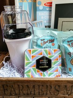 a box filled with coffee and snacks on top of a table