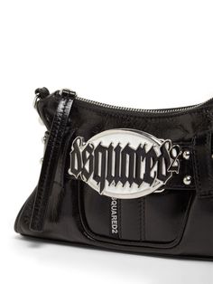 Find DSQUARED2 Gothic Belted Leather Shoulder Bag on Editorialist. Height: 15cm Width: 23cm Depth: 5cm. Strap drop: 56cm. Top handle drop: 23cm. Detachable strap. Detachable metal chain top handle. Top zip closure. Metal logo detail Black Leather Bag With Logo Hardware, Leather Shoulder Bag With Logo Hardware, Trendy Leather Shoulder Bag With Logo Hardware, Leather Rectangular Shoulder Bag With Logo Hardware, Rectangular Leather Shoulder Bag With Logo Hardware, Designer Leather Shoulder Bag With Logo Hardware, Black Crossbody Shoulder Bag With Logo Hardware, Edgy Leather Rectangular Shoulder Bag, Edgy Rectangular Leather Shoulder Bag