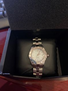 Tag Heuer Women's Watch. Very good condition, with little to no signs of wear. Quartz movement, steel case and band. Box included. Automatic WN2311-0. DT5716. Case: 28mm Link Width: .5in Band Length: 7in Womens Tag Watch, Ladies Tag Watches, Tag Watches Women, Tag Heuer Women, Mystic Fire Topaz, Coral Earrings, Mystic Topaz, Women Wrist Watch, Tag Heuer