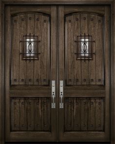 two wooden doors with metal bars on each side and one has a glass paneled door