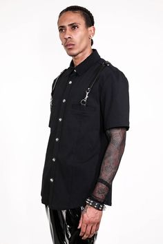 Lip Service Short Sleeve Gangsta Pranksta Shirt. Gangsta Pranksta is back with this all black short sleeve version of the classic Vito the Fixer Randazzo fancy shirt. Lobster clip straps from pockets to center back D-ring. Made in China (because that's where the fabric comes from) Hand Wash Cold, Line Dry 80% poly 20% spandex bengaline with PU details Front Snap Closure Stretch Fit LS-174 Black Shirt For Summer Concerts, Black Grunge Shirt For Summer, Alternative Style Summer Concert Shirt, Black Summer Grunge Shirt, Black Shirt For Concert, Fitted Short Sleeve Grunge Shirt, Alternative Short Sleeve Summer Shirt, Alternative Style Short Sleeve Summer Shirt, Fitted Short Sleeve Shirt For Concert