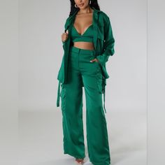 This Is The Ultimate Satin-Like 3-Piece Cargo Set! Bra, Pants, Button-Down Shirt. What More Can A Queen Ask For? Color: Emerald Green Non-Stretch Pant Set 3 Piece Crop Top Spaghetti Strap V-Neck Blouse Collar Long Sleeve Pockets Buttons High-Waisted Pants Pockets Button Closure The Inseam Is 32 Inches Wide-Leg 100% Polyester Hand Wash Cold Bra Has Elastic On Back And Adjustable Straps Model Wearing A Medium, Height 5'6", Weight 145 Lbs Measurements For Large: Top Pit To Pit (Ptp): 23 Buttoned Up Workwear Sets With Pockets, Chic High Waist Sets With Pockets, Green Workwear Sets With Pockets, High Waist Sets With Pockets For Work, High Waist Workwear Sets With Pockets, Green Wide Leg Set With Pockets, Green Wide Leg Sets With Pockets, Chic Green Sets With Pockets, Blouse Collar