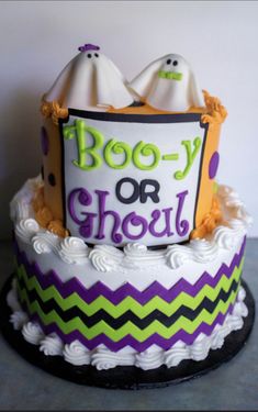 a decorated halloween cake with boo - o - glob and ghost on top