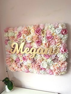 a large flower wall with the word vegan spelled in gold letters on it's side