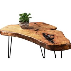 a wooden table with hairpin legs and a potted plant on top