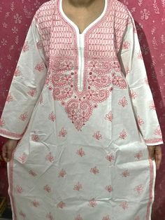 Spruce up your wardrobe with this elegant  Hand Embroidered Kurti Base Colour- White with Pink colour thread Hand Embroidery Fine Handwork of NeedleCraft, Crafted with exquisite Chikankari Hand Embroidery Directly from Lucknow (India), we bring you an exclusive collection of Hand Embroidered Chikankari dresses. Chikankari is a traditional Hand Embroidery style mostly worked on by artisans in and around villages of Lucknow in the North Indian heartland .  Lucknow city is the most renowned place f White Embroidered Fabric For Navratri, White Salwar Kameez With Floral Embroidery And Long Sleeves, White Floral Embroidered Fabric For Navratri, White Bollywood Kurta For Puja, Bollywood Style White Kurta For Puja, Floral Embroidery Straight Kurta For Puja, Traditional White Embroidered Fabric For Puja, White Embroidered Mulmul Fabric For Festivals, Traditional Wear With Floral Embroidery For Puja