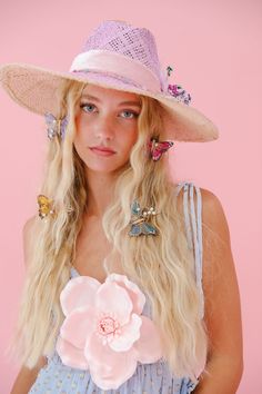 Get ready to turn heads with THE PENELOPE SUN HAT! This lavender beauty features gold accents, a pretty pink ribbon band, delicate white feathers, and a colorful flower combo. Protect your skin in style and add a touch of whimsy to any outfit. This hat is ONE OF A KIND, created by our owner Stephanie. To receive item quicker, expedited shipping is available at checkout. Pink Summer Hat For Garden Party, Pink Mini Hat For Beach Spring Season, Bohemian Pink Hat For Spring, Pink Bohemian Spring Hat, Pink Summer Hats For Kentucky Derby, Pink Summer Hat For Kentucky Derby, Whimsical Pink Summer Hat, Whimsical Spring Vacation Hats, Whimsical Summer Bucket Hat