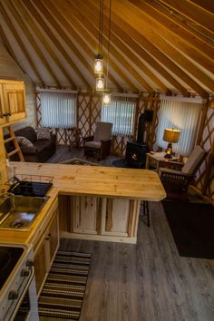 a kitchen and living room inside of a yurt