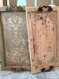 two old frames sitting on top of a table