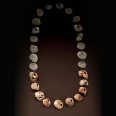 a necklace made out of shells and stones