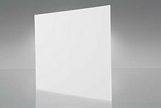 an empty white square box sitting on top of a table