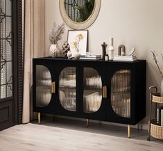 a black and gold sideboard with glass doors in a living room next to a window