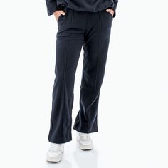 These are not your ordinary sweats. No, the Weekender Pant is a standout because of its sustainable origins and fine details. The fabric is 100% recycled polyester, a fiber hailed for its ability to repurpose plastic waste. Created from rPET, or hard plastic items like water bottles, recycled polyester is spun into the cozy Weekender Pant before you. Microfleece will make you feel wrapped up in a blanket, so soft and lovely against the skin. Of course, we love the small details of this pant, inc Sporty Relaxed Fit Bottoms In Recycled Polyester, Sporty Recycled Polyester Bottoms With Relaxed Fit, Relaxed Fit Bottoms In Recycled Polyester, Relaxed Fit Solid Bottoms In Recycled Polyester, Sporty Relaxed Fit Pants In Recycled Polyester, Sporty Straight Hem Pants For Fall, Casual Bottoms With Pockets In Recycled Polyester, Relaxed Fit Athleisure Bottoms In Recycled Polyester, Athleisure Bottoms In Recycled Polyester With Relaxed Fit