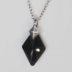 Black Diamond Swarovski Crystal Necklace Is Easy To Dress Up Or Down! Beautifully Faceted Diamond Shaped Pendant Was Difficult To Photograph But Has Many Facets To Catch The Light, Captured On An Antique Silver-Plated Chain With An Extender Accented With A Round Swarovski Crystal. #128 Black Diamond Necklace Gift Silver Necklace With Black Diamonds, Black Diamond Sterling Silver Necklace, Black Crystal Pendant Necklace, Black Crystal Necklace For Gift, Black Diamond-shaped Jewelry For Gift, Black Sterling Silver Necklace For Party, Elegant Black Sterling Silver Crystal Necklace, Party Black Sterling Silver Necklaces, Black Faceted Sterling Silver Necklace