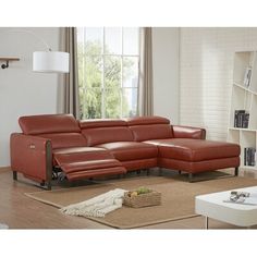 a living room with a red leather sectional sofa