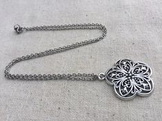 "Chic and pretty boho flower pendant necklace. It has incredible detail and is very versatile. The perfect everyday necklace! It would also make a sweet little gift. The pendant measures 1 1/8\" long by 1\" wide and hangs from a simple stainless steel necklace chain with a lobster clasp. I have matching earrings in my shop, if you would like the whole set. Here is the link https://etsy.me/35eCXaU Thanks for stopping by! Please take a moment and visit the rest of my Etsy shop. I have many more un Bohemian Charm Necklace With Flower Pendant For Gift, Bohemian Flower Pendant Charm Necklace As Gift, Bohemian Metal Jewelry With Flower Charm, Bohemian Necklace With Flower Pendant As Gift, Bohemian Flower-shaped Nickel-free Necklace, Bohemian Necklace With Flower Pendant, Bohemian Flower Pendant Necklace As Gift, Bohemian Flower-shaped Nickel Free Necklace, Silver Necklace With Delicate Chain For Festivals