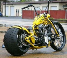 a yellow and black motorcycle parked on the street