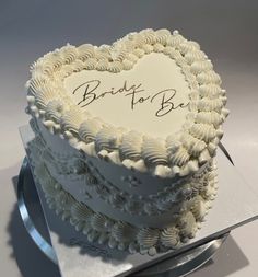 a heart shaped cake with the words bride to be written on it