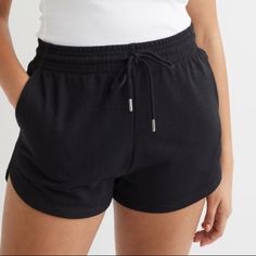 Lightweight Sweatshorts Made From A Cotton Blend. High Waist, Covered, Elasticized Waistband With Drawstring, And Side Pockets. Brand New Never Worn Perfect Condition Black Pajama Shorts With Elastic Waistband, Black Elastic Waistband Pajama Shorts, Black Casual Pajama Shorts, Black Athletic Shorts For Leisure, Black High-waisted Pajama Shorts With Elastic Waistband, Black Loungewear Shorts With Short Inseam, Black Shorts For Loungewear With Short Inseam, Black Lounge Shorts With Short Inseam, Black High-waisted Cotton Pajama Shorts