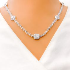 This 18k white gold necklace, weighing 20.5 grams, features a sophisticated evergreen design adorned with 2.72 carats of round diamonds. The diamonds, with an F-G color and VS clarity, add exceptional brilliance and elegance. The necklace measures 17.5 inches in length with an additional 1 inch of adjustable links, and it is secured with a lobster lock. Ideal for those who appreciate luxurious and refined jewelry, this piece adds a touch of timeless sophistication and charm to any collection. It Formal Platinum Bridal Necklace With Diamond Accents, Platinum Diamond Cut Round Bridal Necklace, Round Platinum Bridal Necklace With Diamond Cut, Platinum Bridal Necklace With Diamond Cut, Formal White Gold Moissanite Necklace, Luxury Moissanite Solitaire Necklace For Formal Occasions, Formal Moissanite Diamond-cut Necklace, Platinum Bridal Necklace With Diamond Accents, Formal Diamond White Platinum Necklace