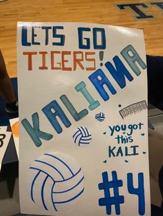 a sign that reads, let's go tigers kalakina you got this ball