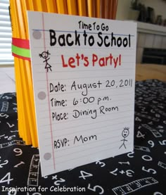 there is a sign on the table that says back to school let's party