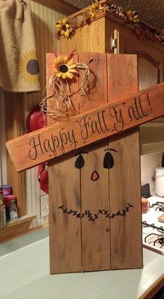 a wooden sign that says happy fall y'all