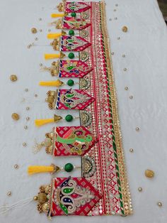 the table is covered with many different types of beaded and tasseled items