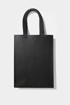 Our take on the classic tote, boasting sturdy construction and clean lines. Main compartment fits up to a 15" laptop. Handmade in Montreal, Canada. Leather Bag Pattern, Minimal Classic, Oversized Tote, Convertible Bags, Montreal Canada, Mini Crossbody, Large Tote, Bag Pattern, Kate Spade Top Handle Bag