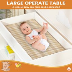 a baby laying in a crib with the words large operate table above it