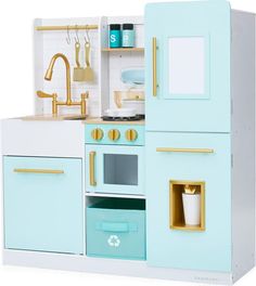 a blue and white play kitchen with gold handles on the door, sink, stove and oven