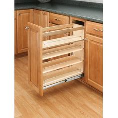 an open cabinet drawer in a kitchen