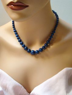 "Sale Blue Lapis Lazuli Necklace. Natural Lapis necklace. Descending necklace. Dark blue stone jewelry. Genuine Lapis necklace. Royal blue necklace. Sale, 10% off. Handmade, descending, natural royal blue Lapis Lazuli gemstone beaded necklace. Beautiful, polished, round Lapis beads are dark blue with specks of white and golden pyrite, they differ in size from to 6 mm to 16 mm in diameter (as in the photo). Standard length as on the photo is 18\" long plus 2\" extender. The same necklace can be m Elegant Single Strand Blue Jewelry, Elegant Blue Single Strand Jewelry, Blue Lapis Lazuli Round Necklace, Elegant Blue Gemstone Bead Crystal Necklace, Elegant Blue Crystal Necklaces With Gemstone Beads, Elegant Blue Necklace With Round Beads, Elegant Blue Crystal Necklaces With Round Beads, Elegant Blue Crystal Necklace With Round Beads, Elegant Blue Gemstone Beads Jewelry