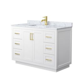 a white bathroom vanity with gold faucet and marble counter top, against a white background