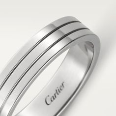 a white gold wedding band with three stripes