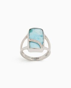 The Stone Ring is a breathtaking style that is guaranteed to capture attention. Handcrafted from sterling silver, this ring showcases an elegant ribbon design adorned with our distinctive reef texture, set against a rectangular larimar cabochon. Wear this ring solo for a statement look or pair it with others for a more personalized touch. Metal: Sterling silver Stone: Larimar Band Width: 3mm Stone Size: 20mm x 10mm Style #: OR190L Elegant Blue Larimar Turquoise Ring, Elegant Blue Larimar Rings, Elegant Turquoise Larimar Ring As Gift, Elegant Larimar Rings For Anniversary, Elegant Polished Sterling Silver Turquoise Ring, Elegant Sterling Silver Turquoise Ring With Polished Finish, Elegant Larimar Jewelry For Formal Events, Hook Bracelet, Ribbon Design